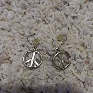 Silver peace earrings with a jewel in the middle